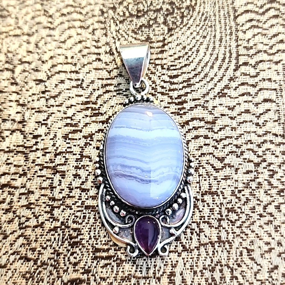 Beautiful Owyhee opal pendant with amethyst accent